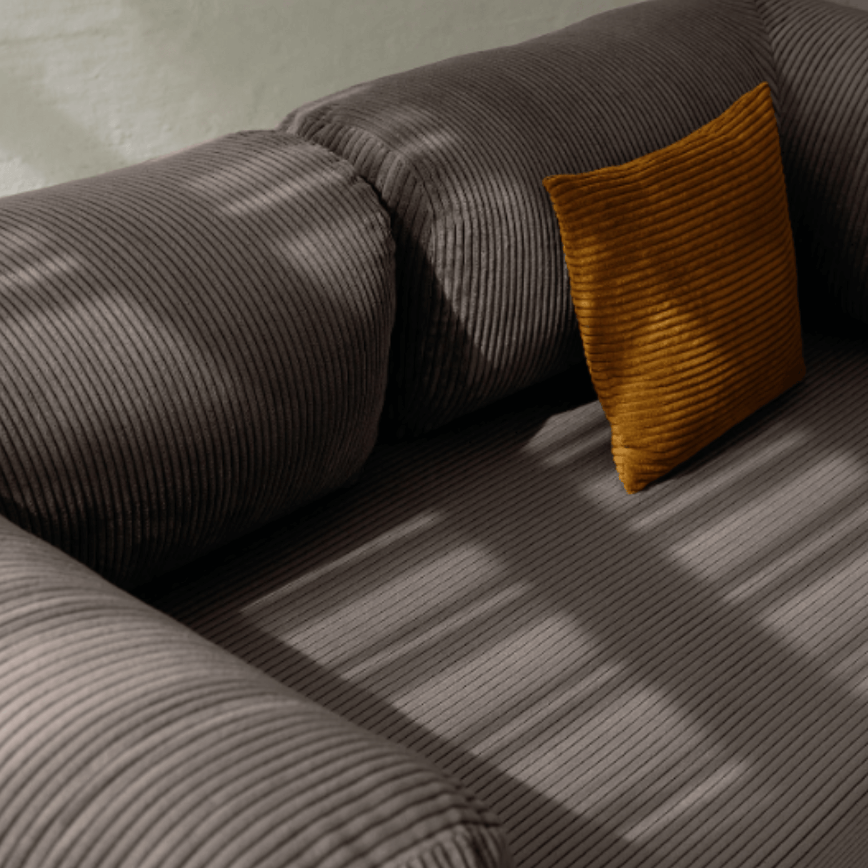 Primyhome coffee brown corduroy convertible sofa bed fabric close-up with soft natural light shadows