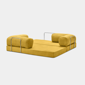 Fully unfolded Primyhome Ginger Yellow corduroy sleeper sofa bed with metal support on a clean white background