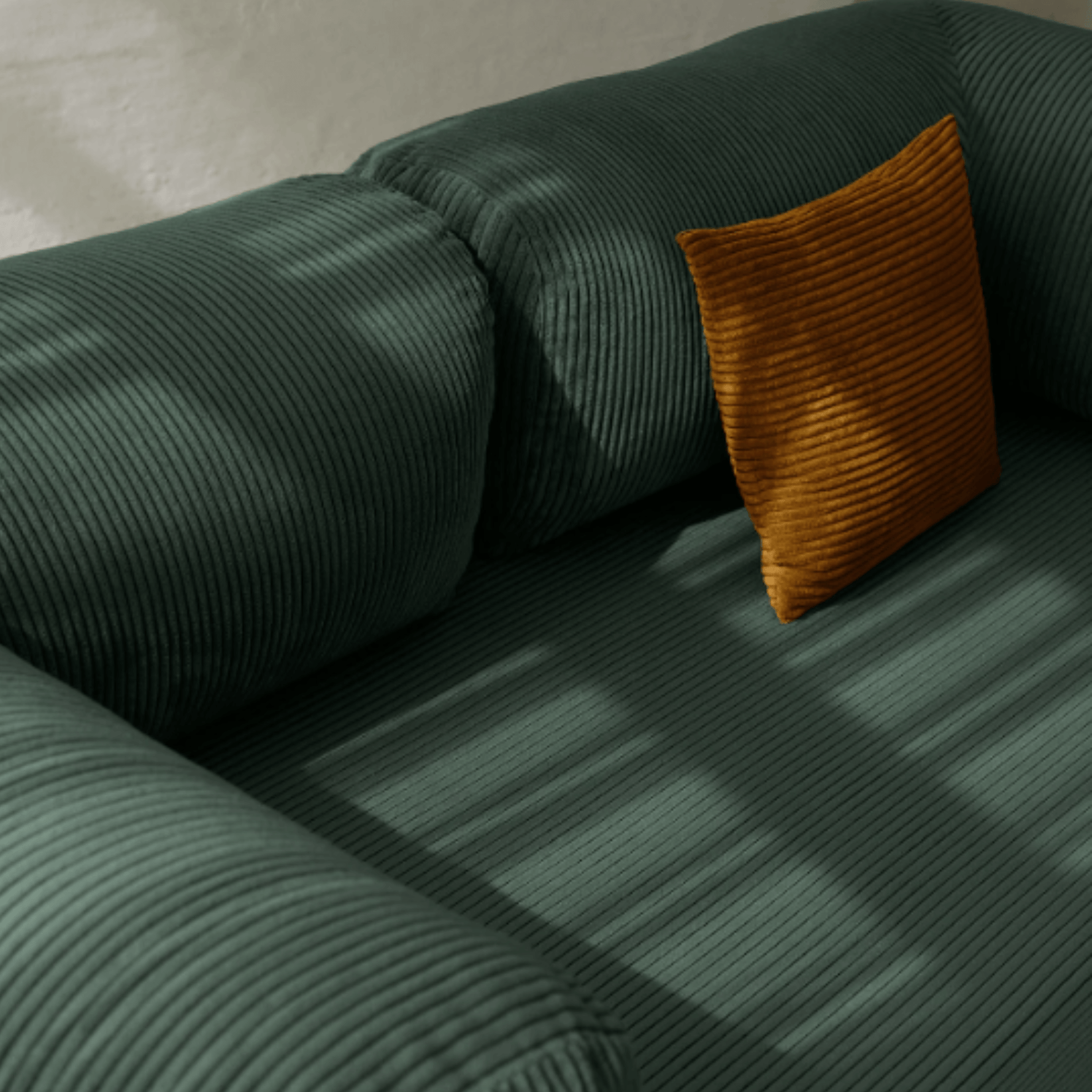Primyhome green corduroy convertible sofa bed fabric close-up with soft natural light shadows