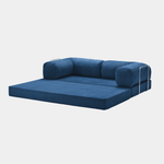 Primyhome navy blue convertible sleeper sofa bed in unfolded position, showcasing the corduroy fabric and metal side rails